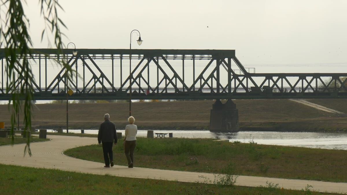 Older couple enjoying a quiet moment outdoors near Saginaw